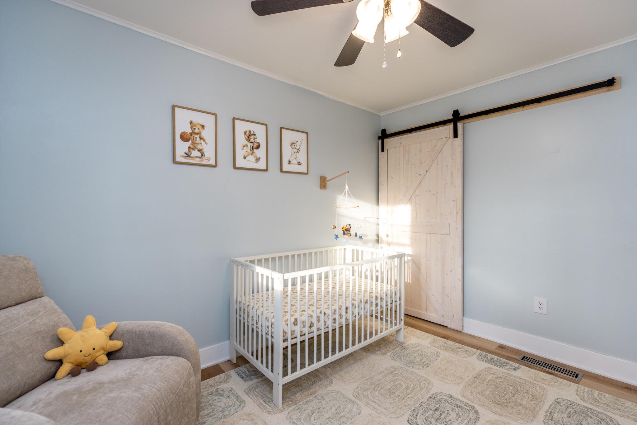 3427 York Street Manchester, MD 21102 - Photo 12 of 26 a bedroom with a bed and a window