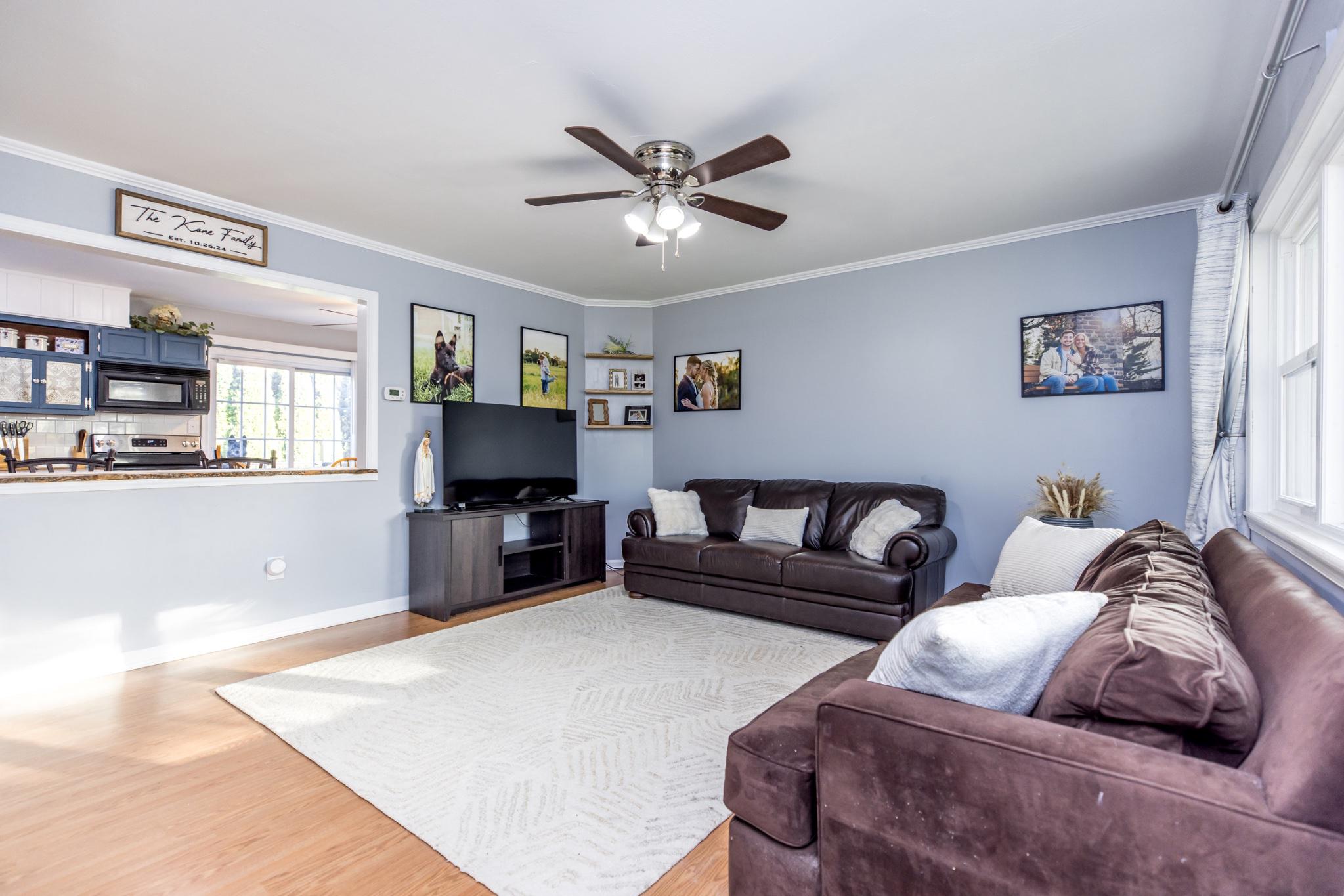 3427 York Street Manchester, MD 21102 - Photo 2 of 26 a living room with furniture and a flat screen tv