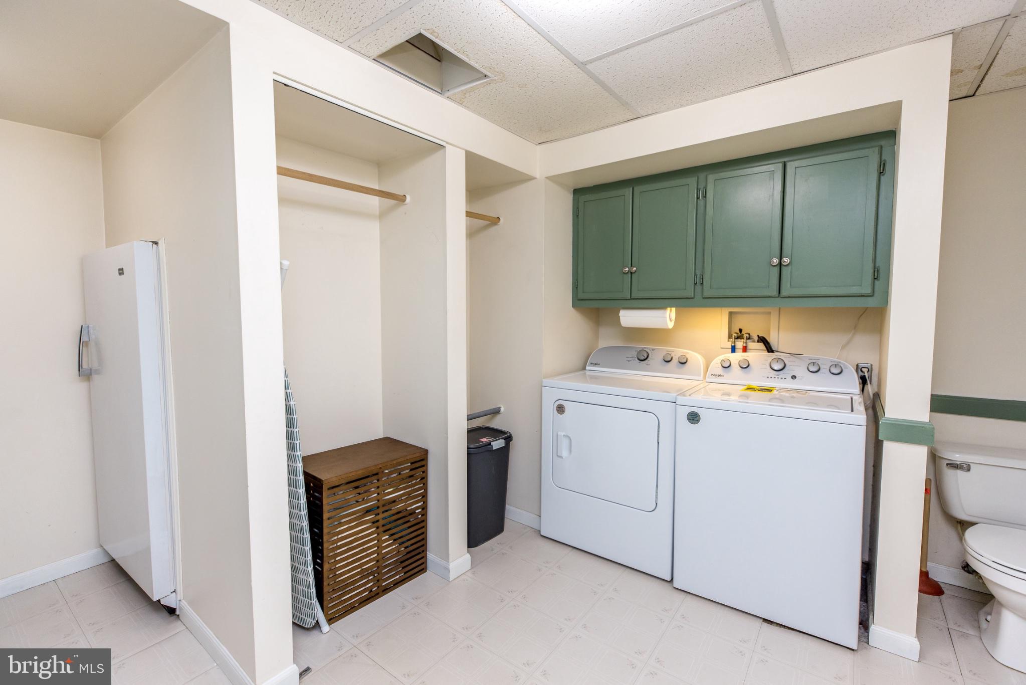 3427 York Street Manchester, MD 21102 - Photo 21 of 26 a utility room with cabinets washer and dryer