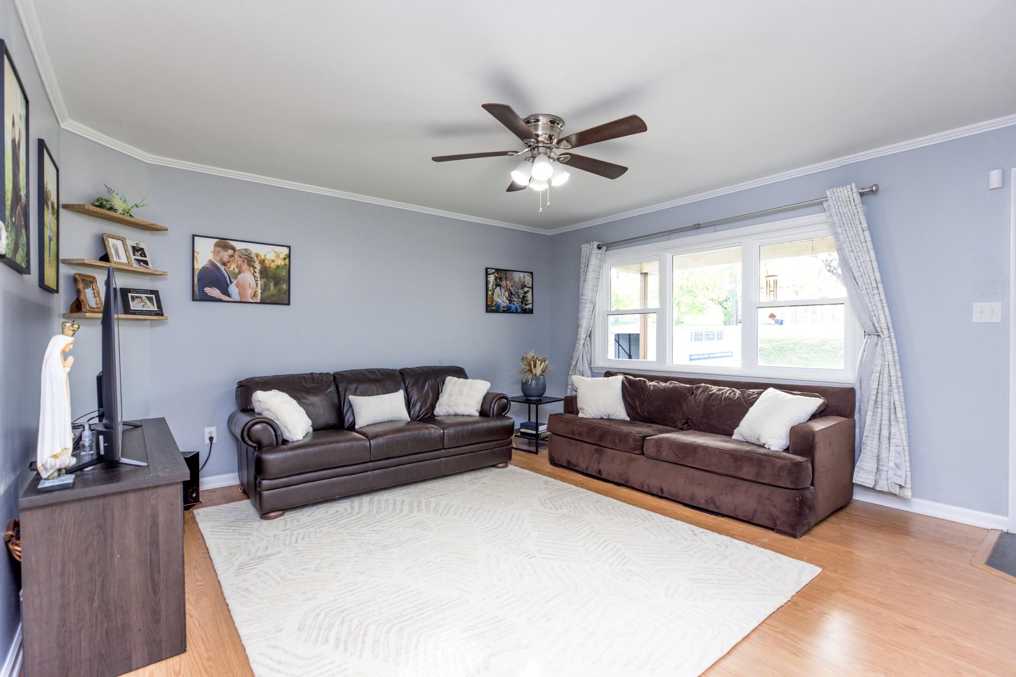 3427 York Street Manchester, MD 21102 - Photo 3 of 26 a living room with a couch and a window