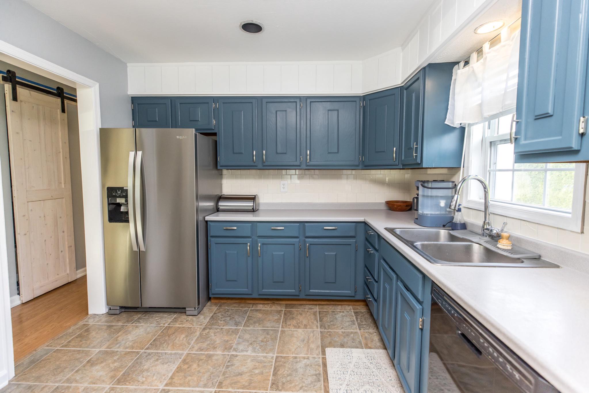 3427 York Street Manchester, MD 21102 - Photo 5 of 26 a kitchen with stainless steel appliances granite countertop a refrigerator sink and cabinets