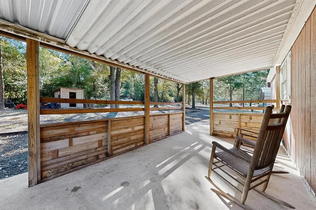 a view of a patio with a table chairs and a patio