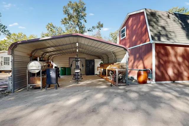 a view of a room with furniture and wooden floor