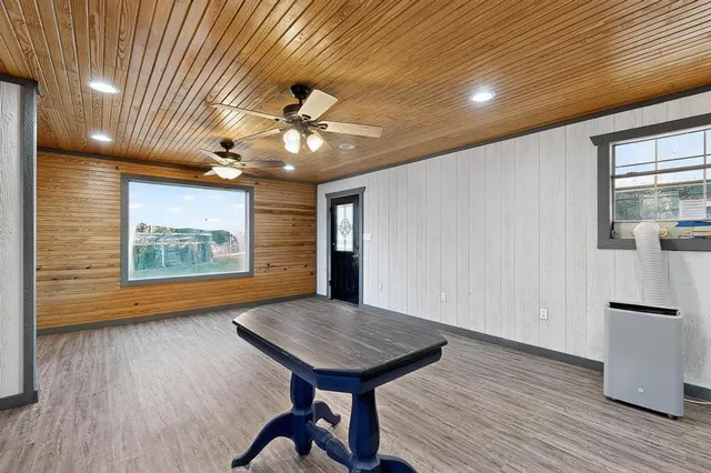a view of kitchen with sink microwave and stove