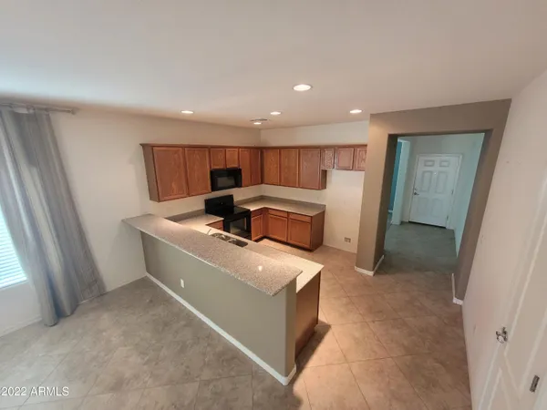 a view of kitchen with sink washer and dryer