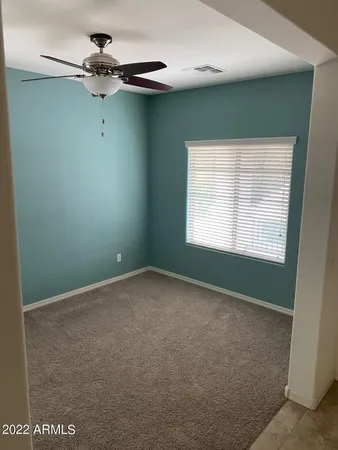 a view of a room that has a window in it