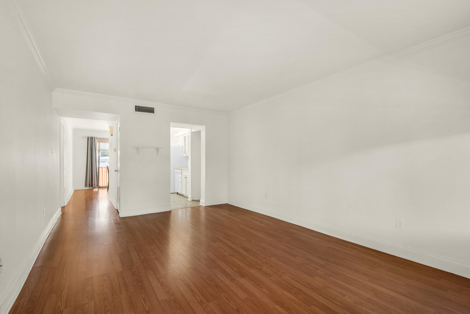 210 Pelham Road, Unit 215B Fort Walton Beach, FL 32547 - Photo 11 of 22 a view of an empty room and wooden floor