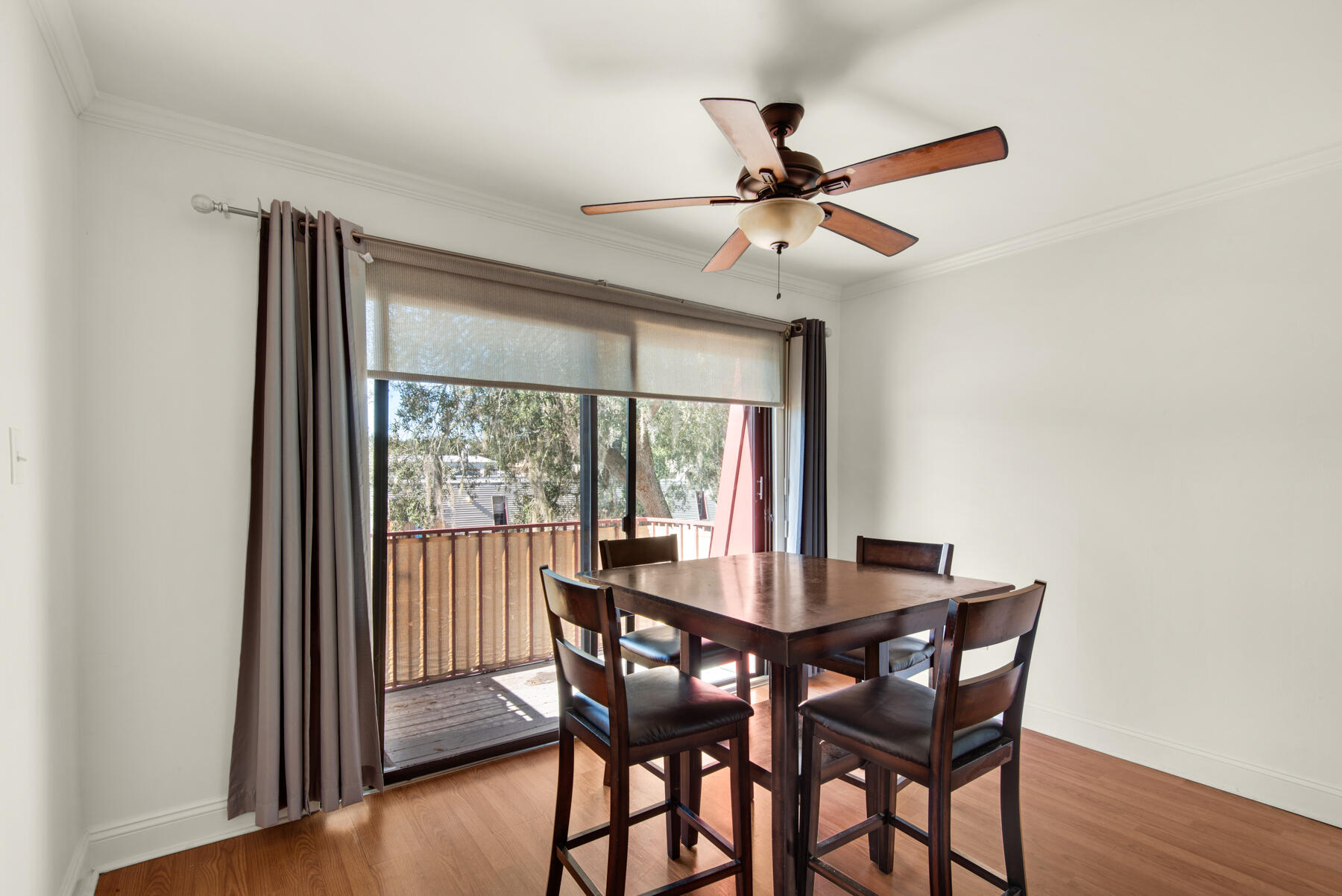 210 Pelham Road, Unit 215B Fort Walton Beach, FL 32547 - Photo 12 of 22 a dining room with furniture window and wooden floor