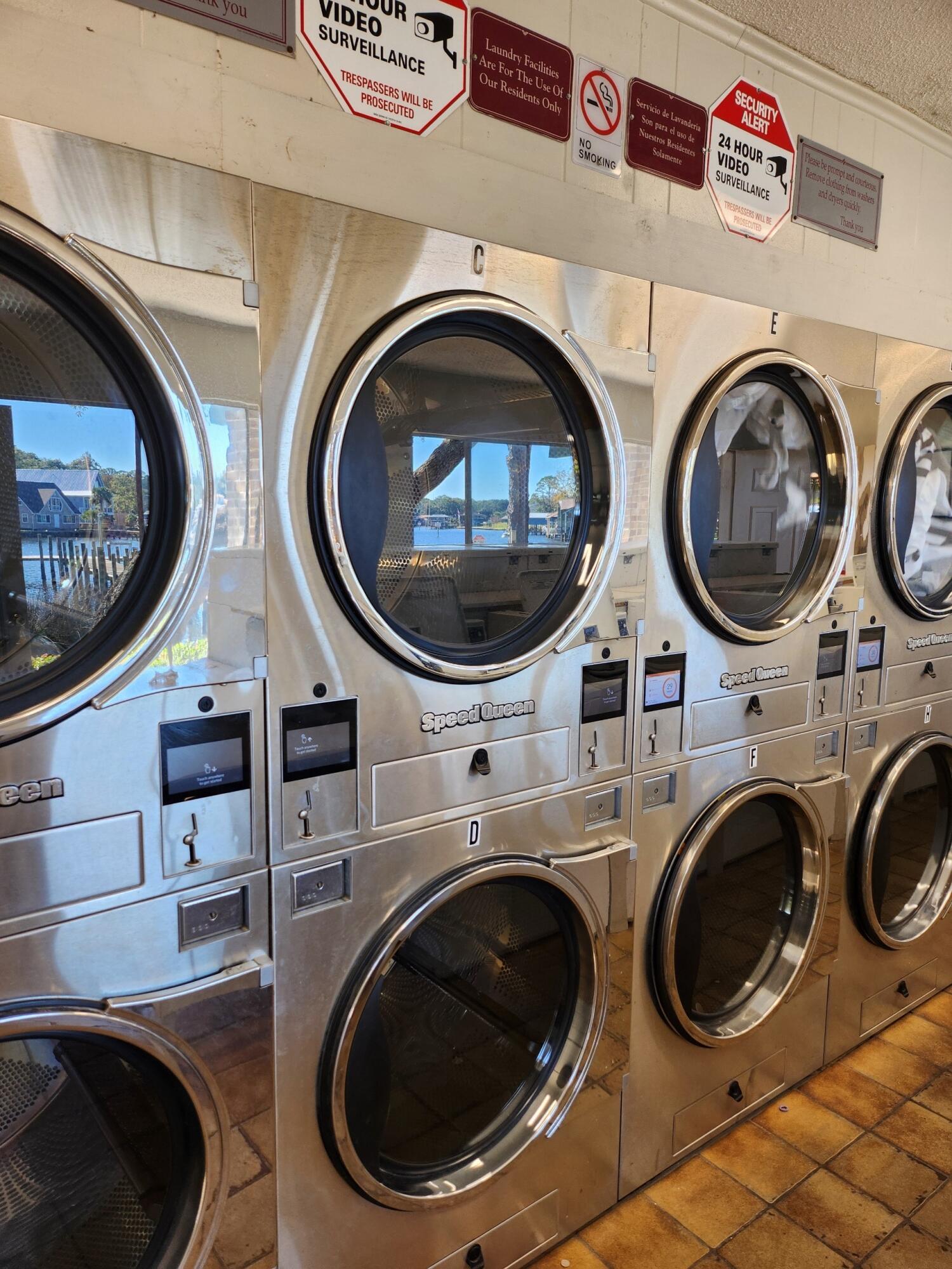 210 Pelham Road, Unit 215B Fort Walton Beach, FL 32547 - Photo 20 of 22 a view of a washer and dryer in a utility room