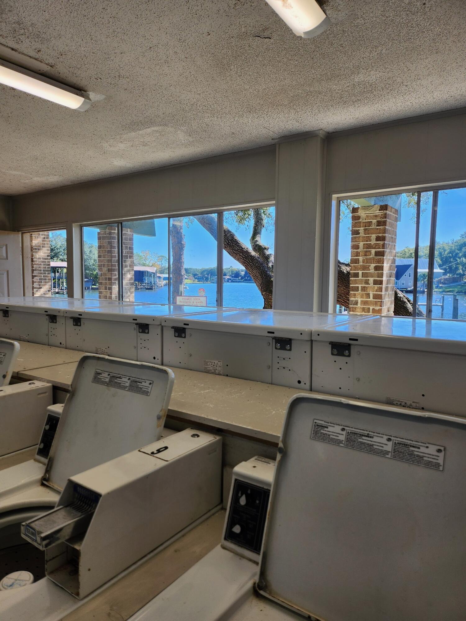 210 Pelham Road, Unit 215B Fort Walton Beach, FL 32547 - Photo 21 of 22 a room with a desk chair and windows