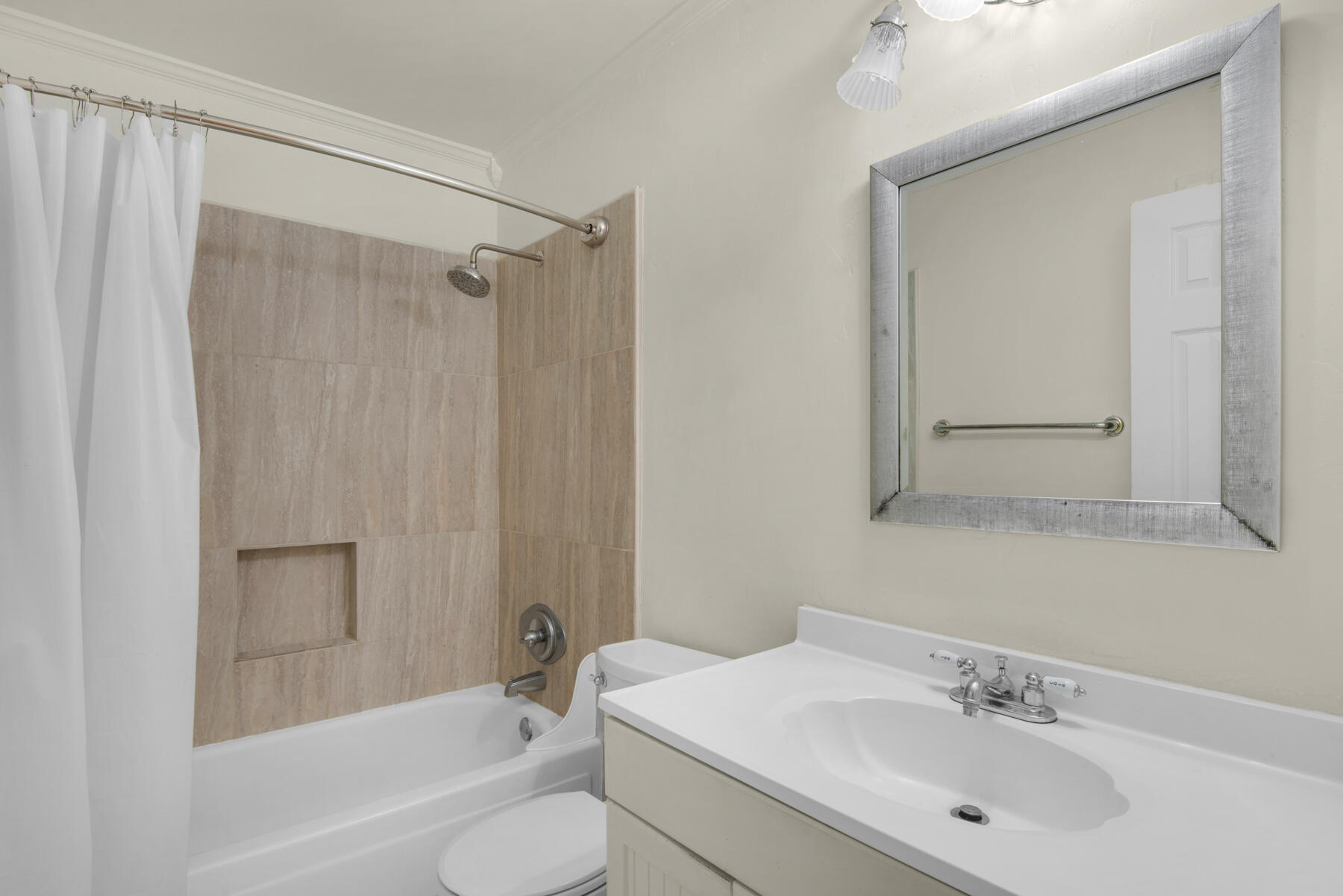 210 Pelham Road, Unit 215B Fort Walton Beach, FL 32547 - Photo 3 of 22 a bathroom with a sink toilet and shower