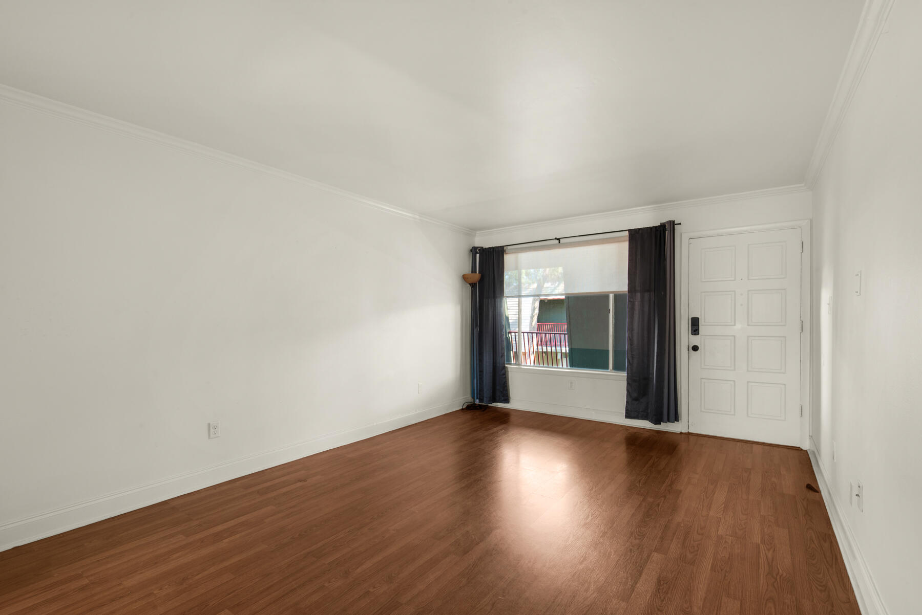 210 Pelham Road, Unit 215B Fort Walton Beach, FL 32547 - Photo 10 of 22 an empty room with wooden floor and windows