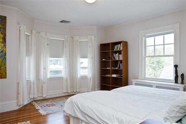 128 Allerton Road Newton, MA 02461 - Photo 8 of 10 a bedroom with a bed and a window