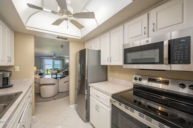 a kitchen with a appliances and cabinets