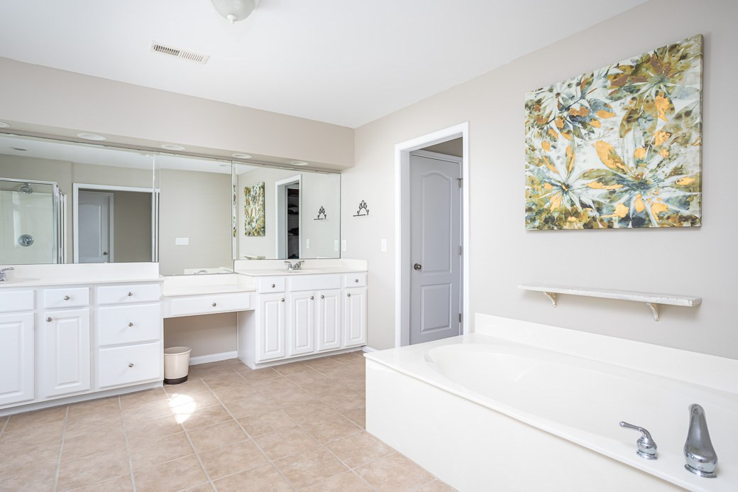 8206 Marvino Lane Raleigh, NC 27613 - Photo 15 of 30 Huge double vanities, tile flooring, and separate water closet are nice touches in this Master bath! Master Bath/Spa