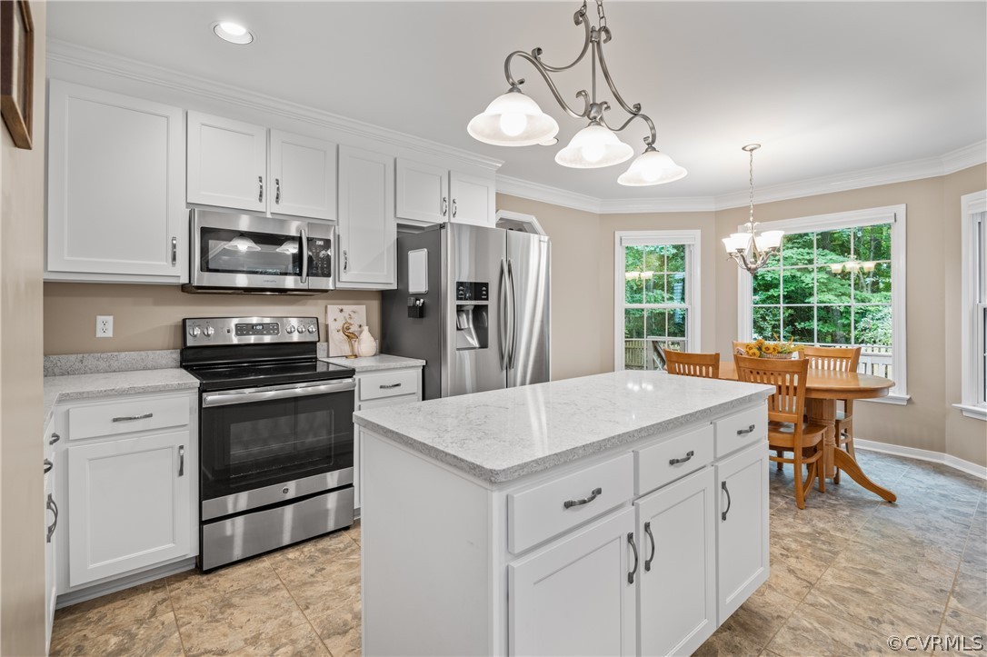 5303 Meadow Chase Road Midlothian, VA 23112 - Photo 13 of 49 a kitchen with a stove a sink a center island and cabinets