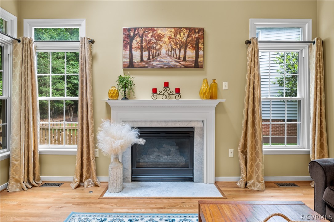 5303 Meadow Chase Road Midlothian, VA 23112 - Photo 20 of 49 a living room with a fireplace and a window