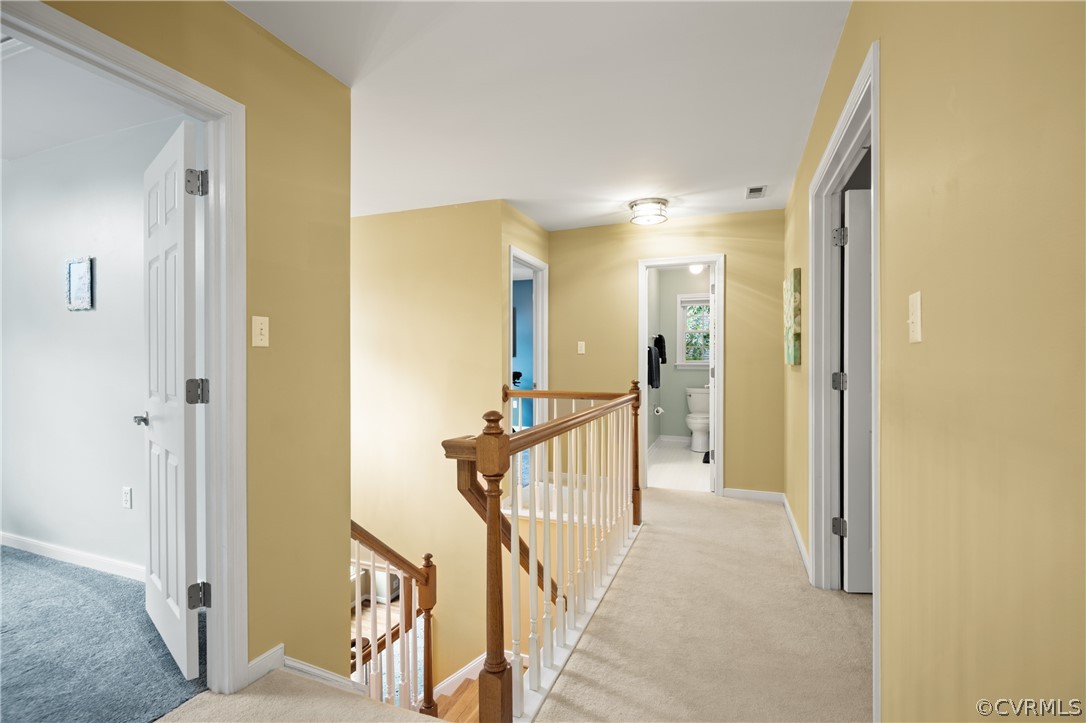 5303 Meadow Chase Road Midlothian, VA 23112 - Photo 27 of 49 a view of a hallway with wooden floor and staircase