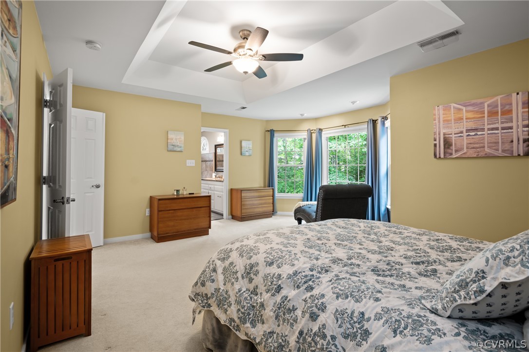 5303 Meadow Chase Road Midlothian, VA 23112 - Photo 33 of 49 a bedroom with a large bed and a chandelier