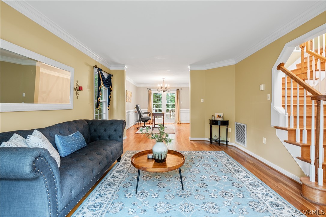 5303 Meadow Chase Road Midlothian, VA 23112 - Photo 5 of 49 a living room with furniture a rug and a large window