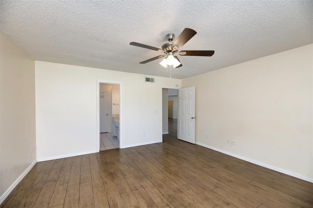 1410 Brookside Drive Allen, TX 75002 - Photo 11 of 38 a view of an empty room with wooden floor