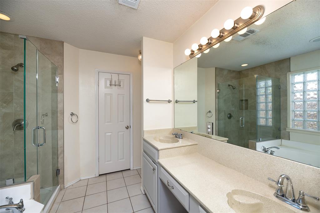 1410 Brookside Drive Allen, TX 75002 - Photo 12 of 38 a bathroom with a sink double vanity and shower