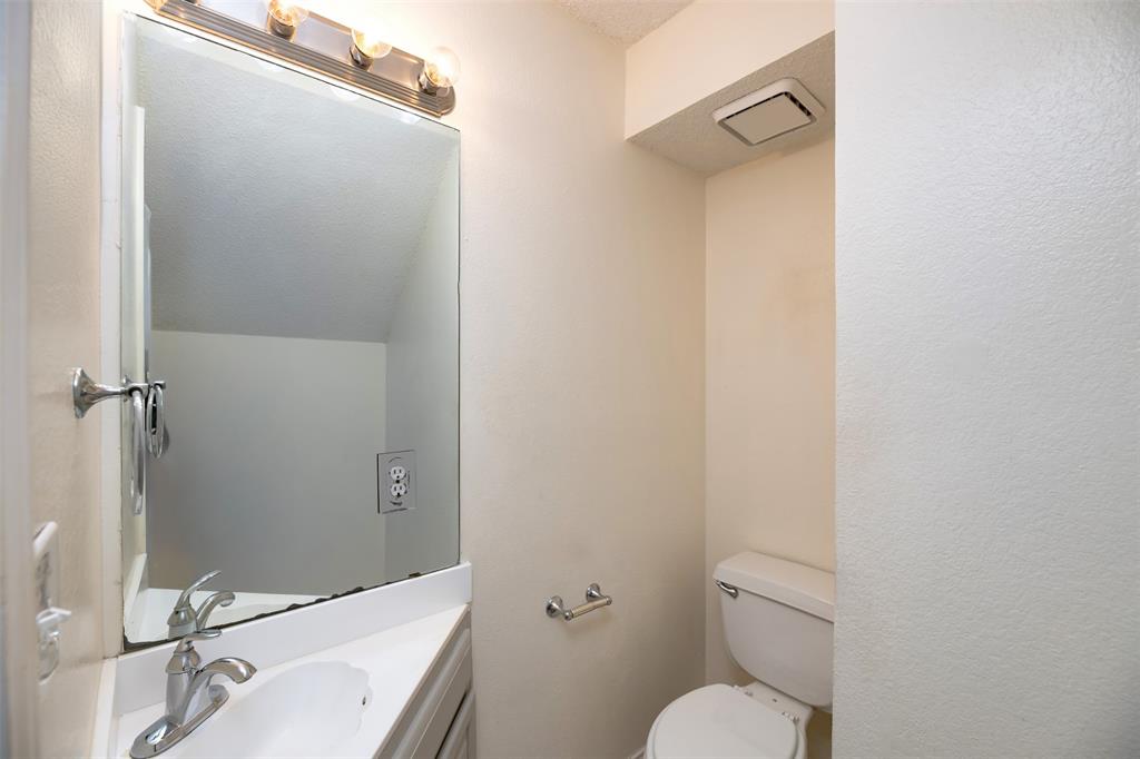 1410 Brookside Drive Allen, TX 75002 - Photo 15 of 38 a bathroom with a sink toilet and shower