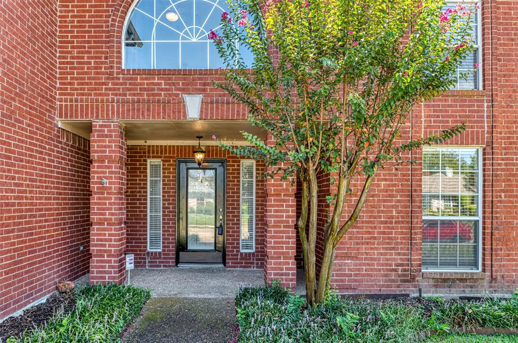1410 Brookside Drive Allen, TX 75002 - Photo 2 of 38 a front view of a house with a garden