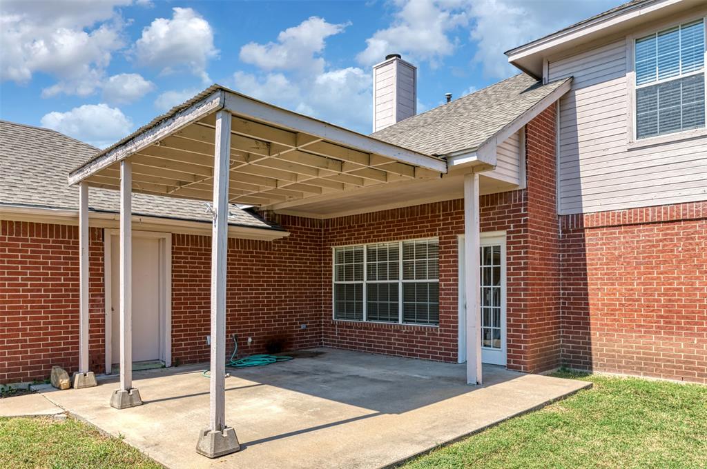 1410 Brookside Drive Allen, TX 75002 - Photo 30 of 38 a front view of a house with a garden