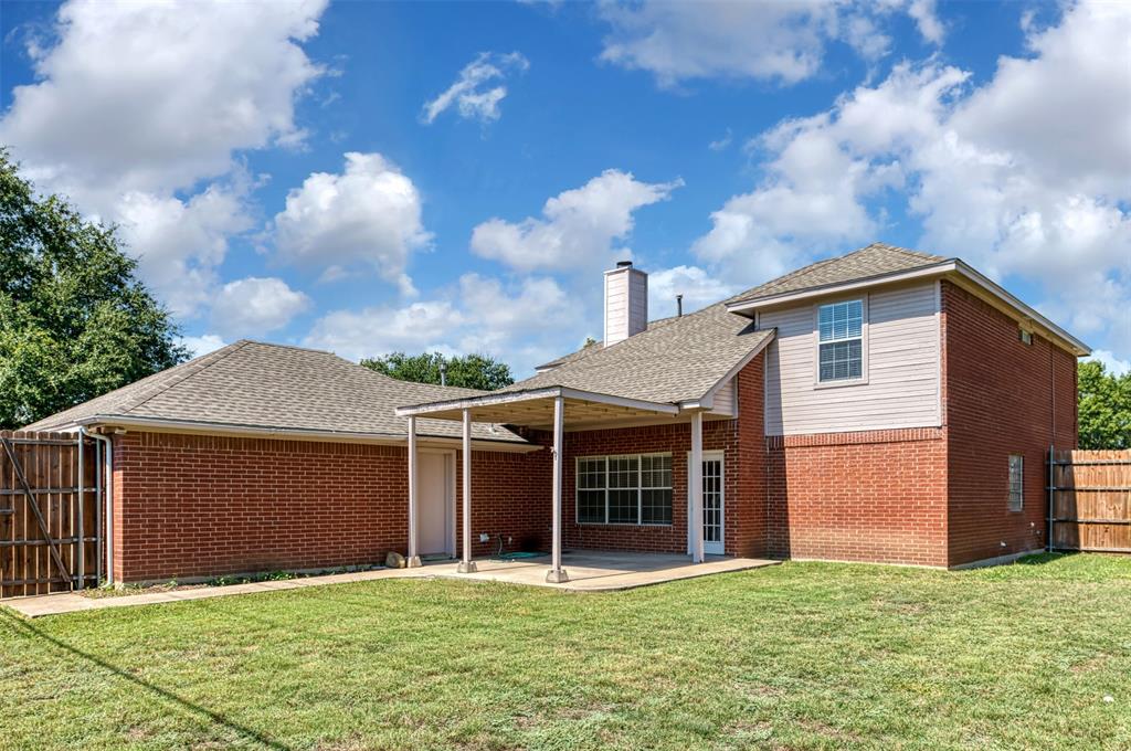 1410 Brookside Drive Allen, TX 75002 - Photo 32 of 38 a front view of a house with a yard and garage
