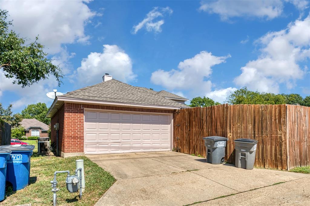 1410 Brookside Drive Allen, TX 75002 - Photo 34 of 38 a front view of a house with garden