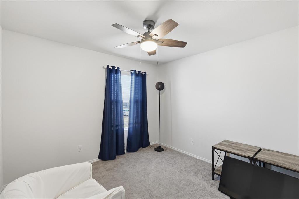 16041 Pious Drive Haslet, TX 76052 - Photo 23 of 36 Sitting room featuring light colored carpet and a ceiling fan