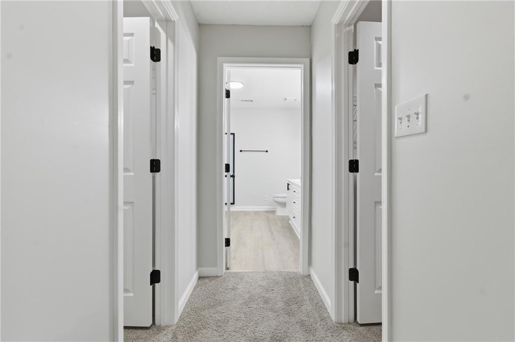 2110 Meadow View Court Grayson, GA 30017 - Photo 31 of 50 an empty room with cabinet and mirror