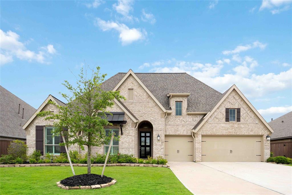 In the lovely community of Del Bello Lakes in Manvel, you'll discover this paradise at 6214 Marsh Creek Lane.