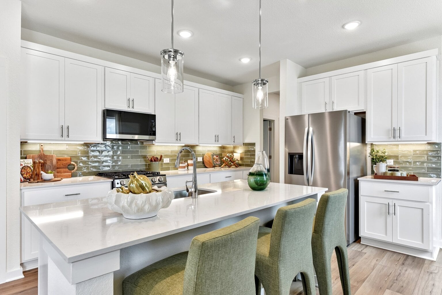 10609 Trifecta Way Buda, TX 78610 - Photo 15 of 17 Culinary delights await in this bright kitchen, complete with a generous island and sleek appliances.