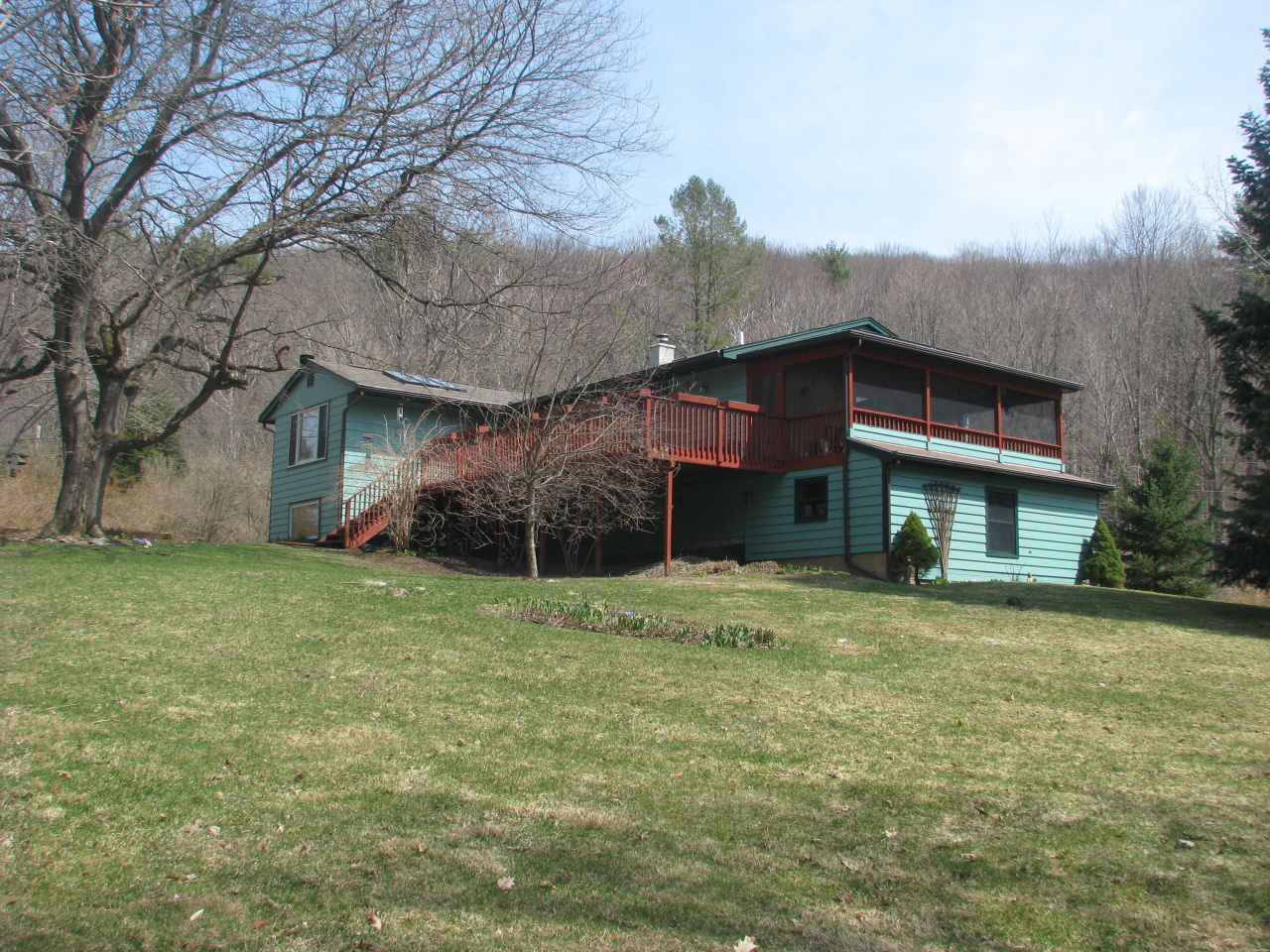 47 Lenox Road West Stockbridge, MA 01266 - Photo 2 of 25 a big house with trees in front of it