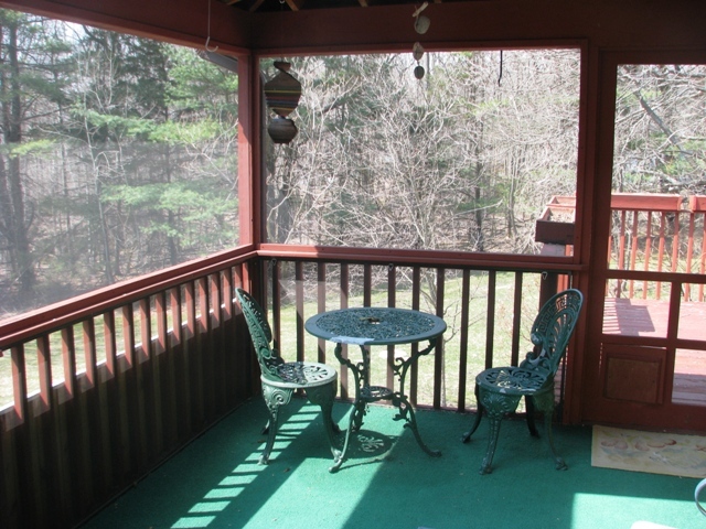 47 Lenox Road West Stockbridge, MA 01266 - Photo 20 of 25 a view of a porch with furniture and a yard