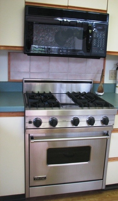 47 Lenox Road West Stockbridge, MA 01266 - Photo 9 of 25 a stove top oven sitting inside of a kitchen