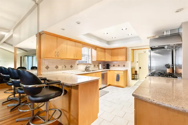 a kitchen with a stove and a microwave