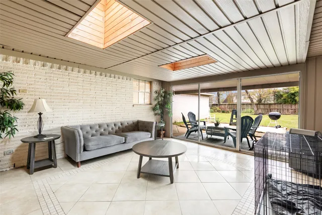 a lobby with furniture and a table