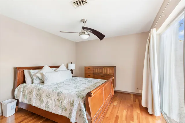 a bathroom with a sink toilet vanity and shower
