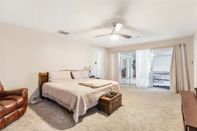 a spacious bathroom with a double vanity sink a mirror and a shower