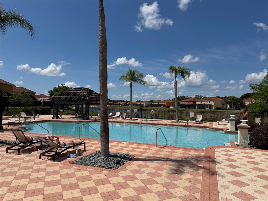 4573 Ada Lane Kissimmee, FL 34746 - Photo 30 of 37 a view of a swimming pool with a patio