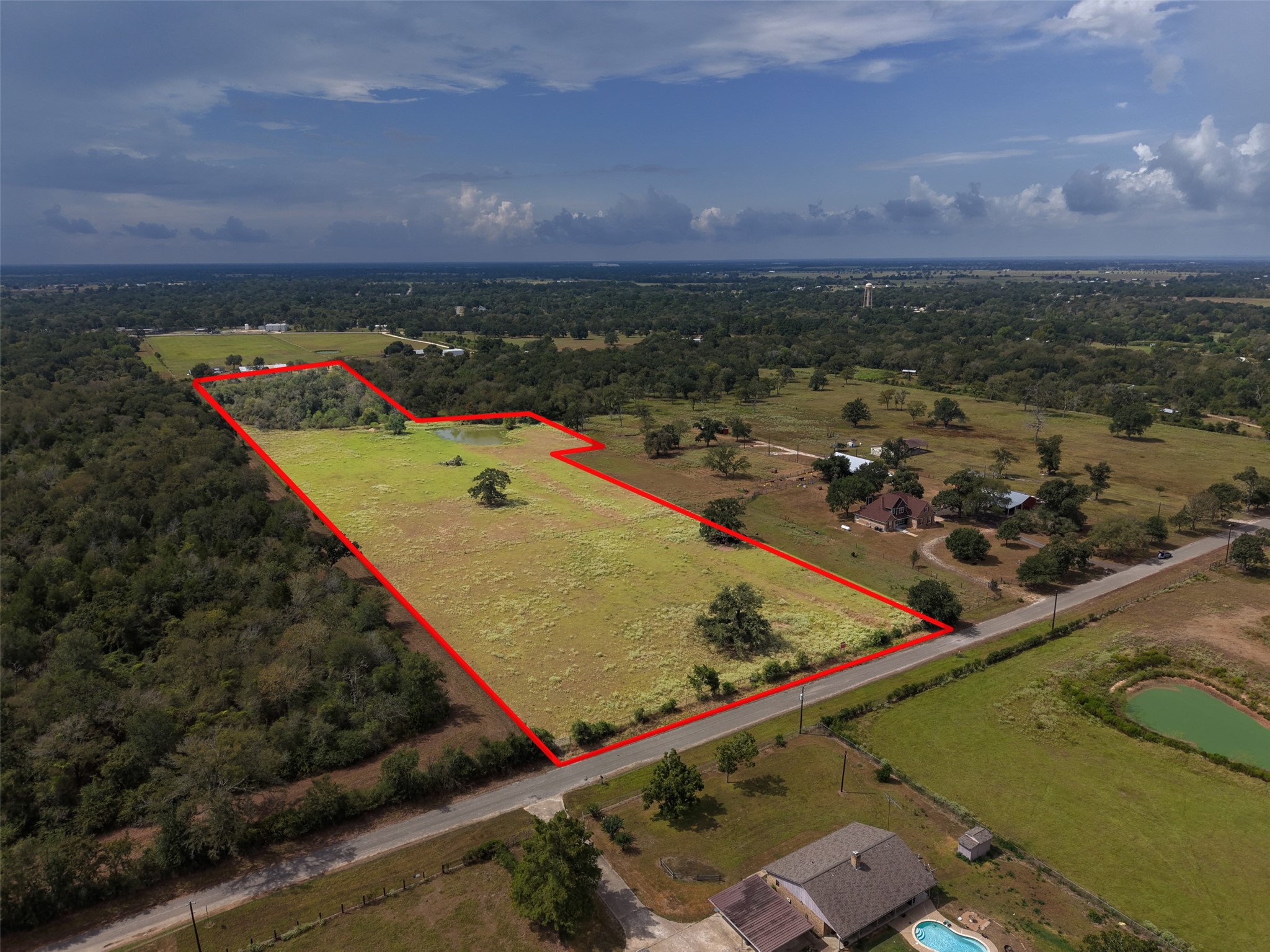 38021 Wiggins Road Hempstead, TX 77445 - Photo 3 of 19 Aerial view with property boundaries outlined, clearly illustrating the tract’s configuration, frontage, and substantial depth.
