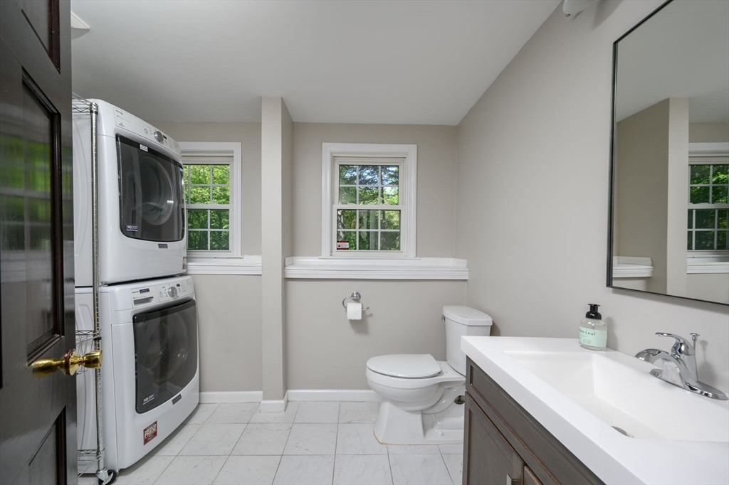 75 Popes Lane Hingham, MA 02043 - Photo 25 of 42 a bathroom with a toilet sink and mirror