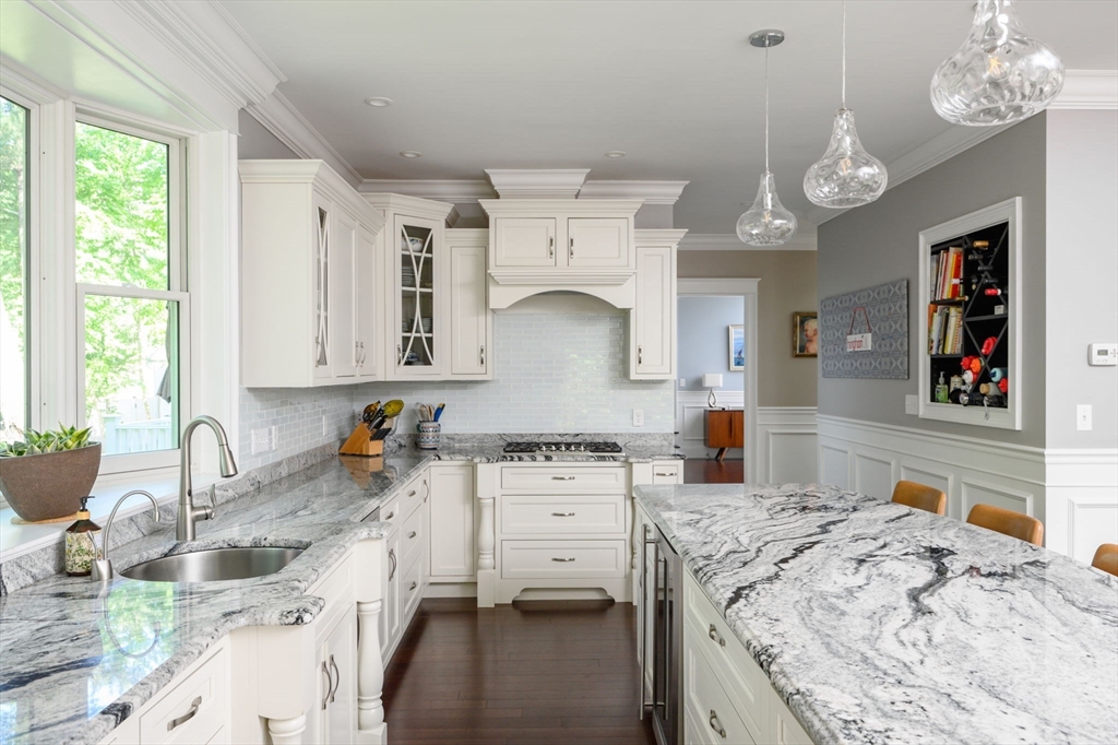 75 Popes Lane Hingham, MA 02043 - Photo 8 of 42 a kitchen with stainless steel appliances granite countertop a sink stove and cabinets