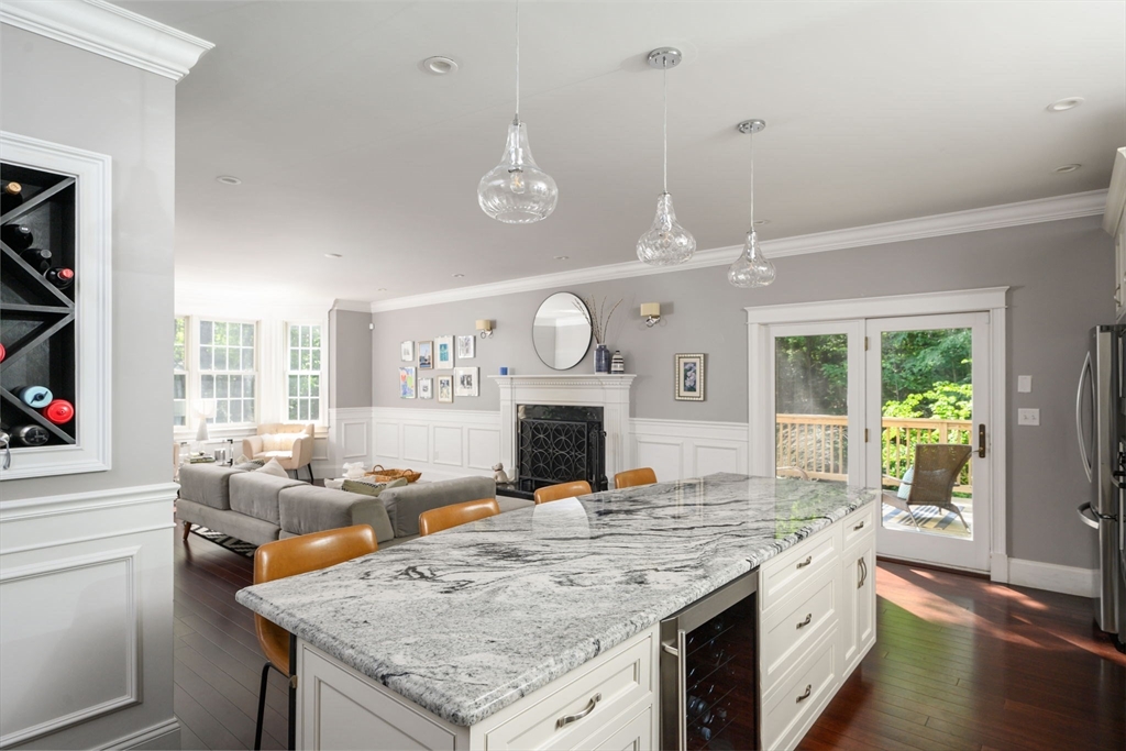 75 Popes Lane Hingham, MA 02043 - Photo 9 of 42 a living room with granite countertop furniture a fireplace and a large window