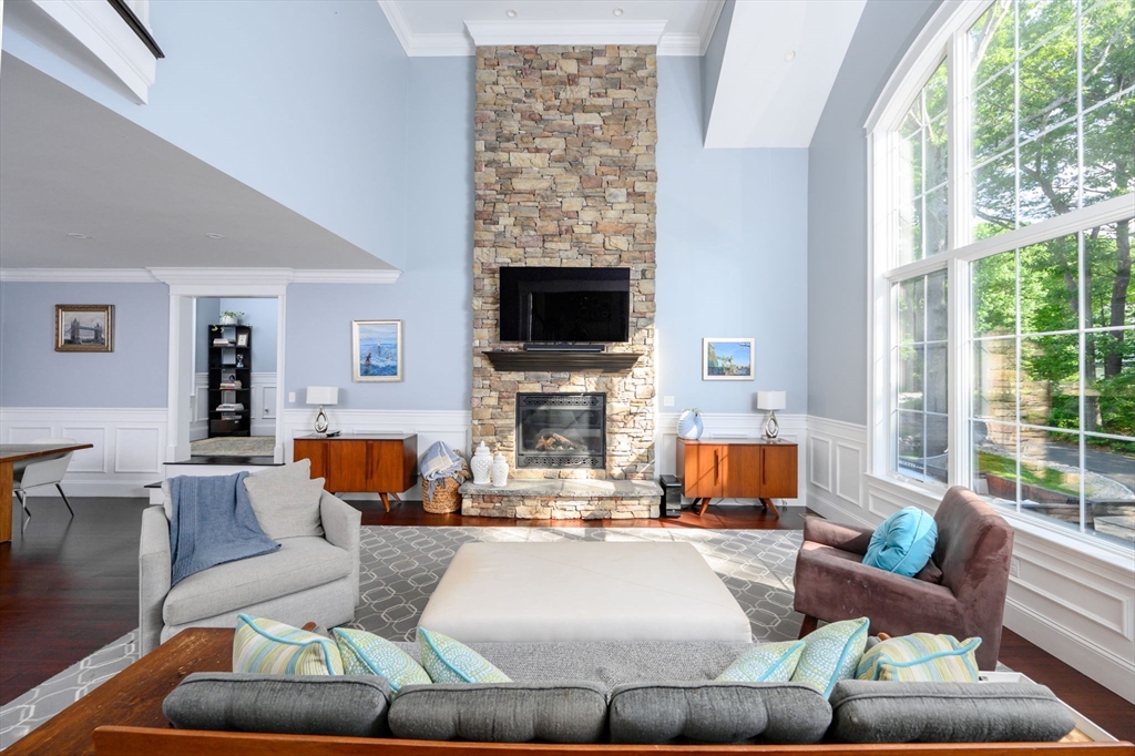 75 Popes Lane Hingham, MA 02043 - Photo 10 of 42 a living room with fireplace furniture and a flat screen tv