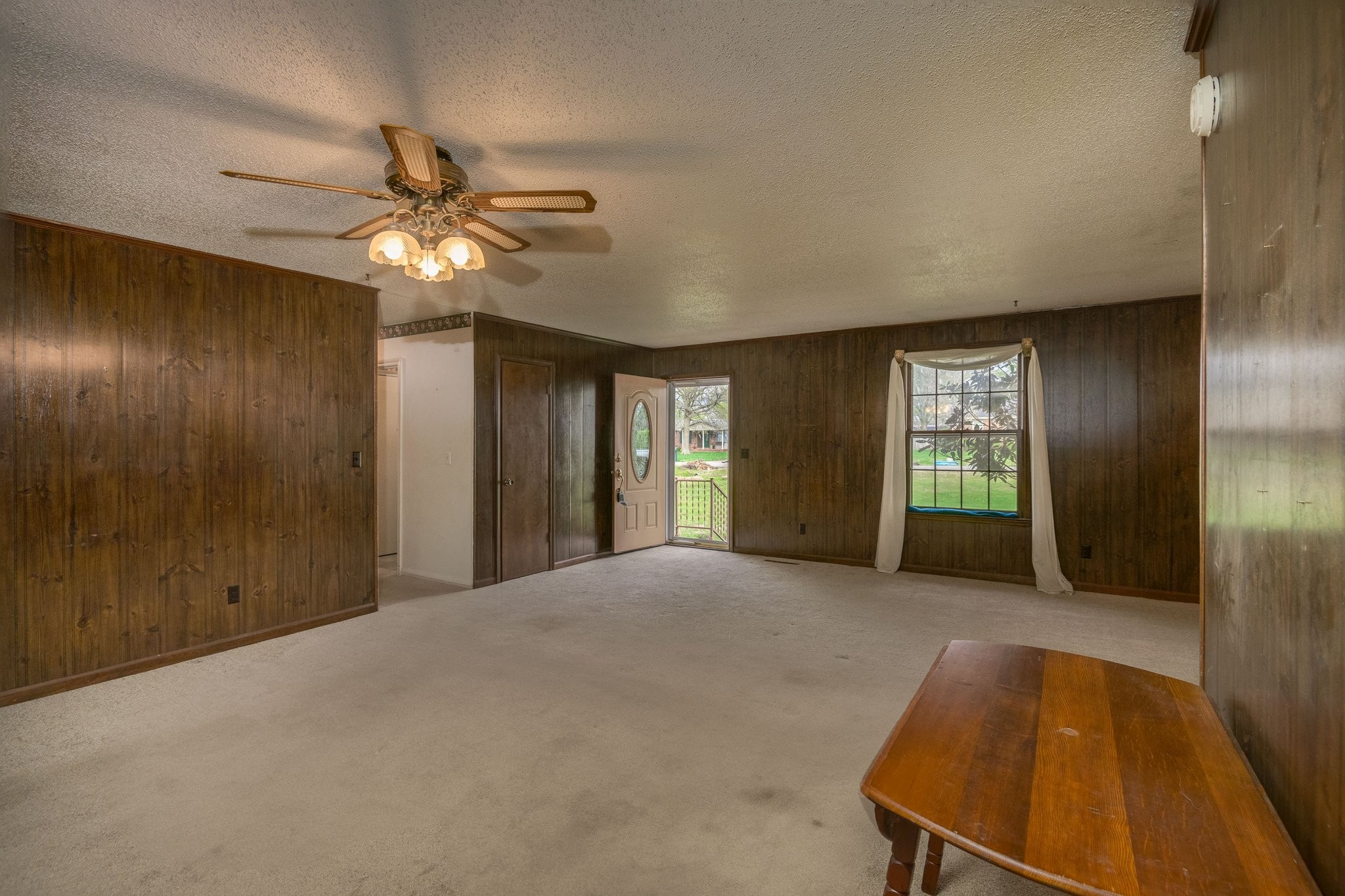 808 Windmere Drive Lebanon, TN 37090 - Photo 18 of 82 a view of an empty room with window and chandelier fan