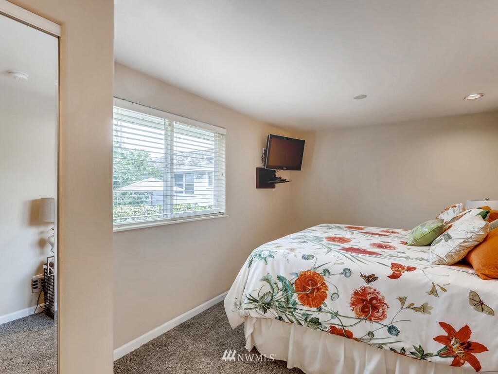 3708 Northeast 10th Street Renton, WA 98056 - Photo 14 of 28 a bedroom with a bed and a window